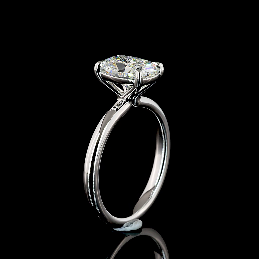 2.07ct lab grown cushion diamond solitaire engagement ring in 14k white gold on a black background.