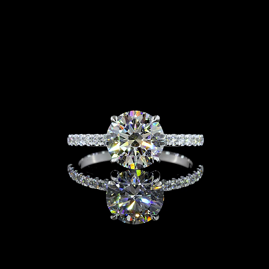 Lab grown round diamond engagement ring with a hidden halo and pavé band in 14k white gold.