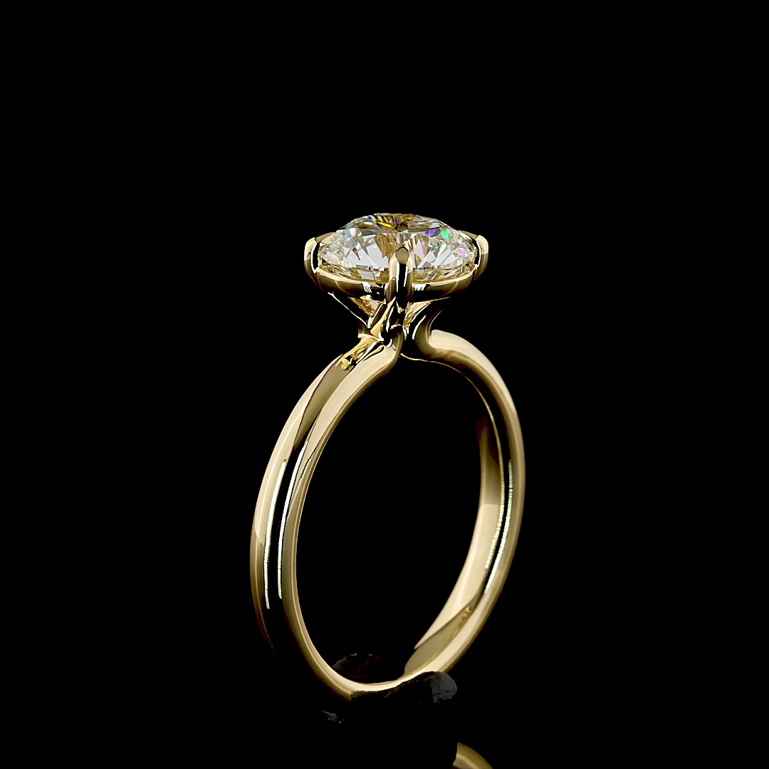 A 2.14ct round lab grown diamond solitaire engagement ring in 14k yellow gold.