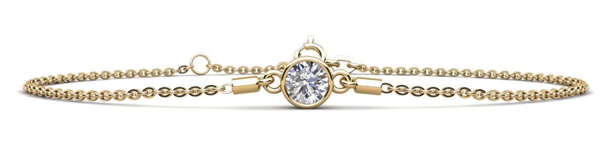 A delicate gold chain bracelet featuring a single round diamond in a bezel setting.