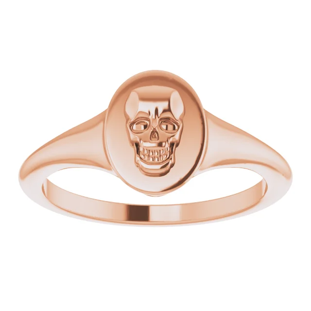 Rose gold skull signet ring.