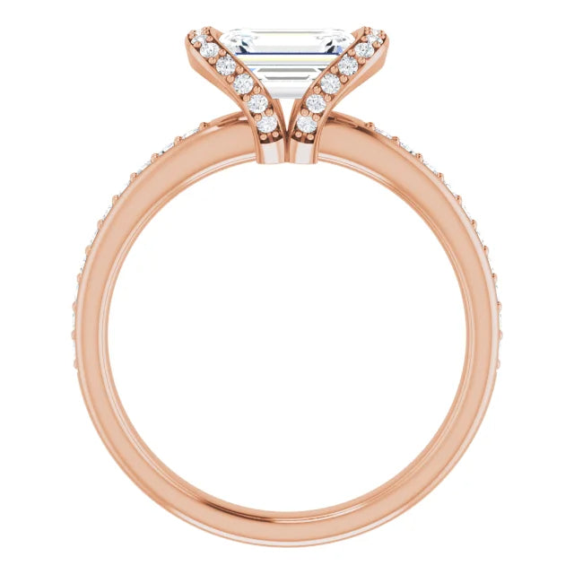 Emerald cut diamond engagement ring with a diamond halo and band.