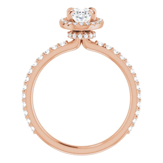 Oval natural diamond halo ring with pavé set diamonds on the band.