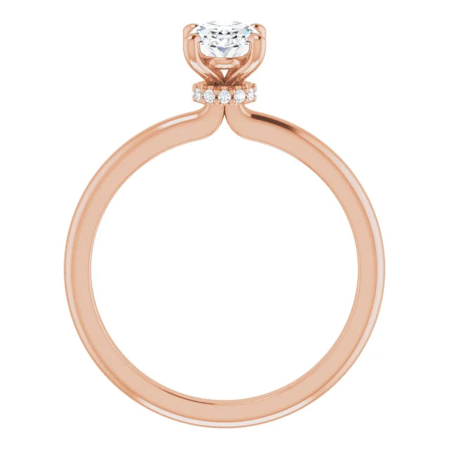 Oval solitaire ring with pavé diamond crown gallery in rose gold.