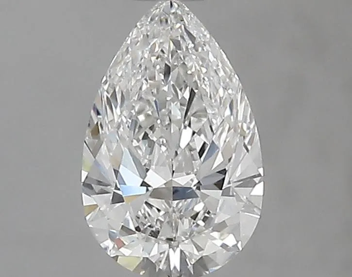 A 0.70 carat pear-shaped natural diamond with F color and VS1 clarity.