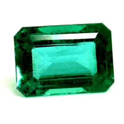 A 0.76 carat faceted emerald gemstone with a green color and slight inclusions.