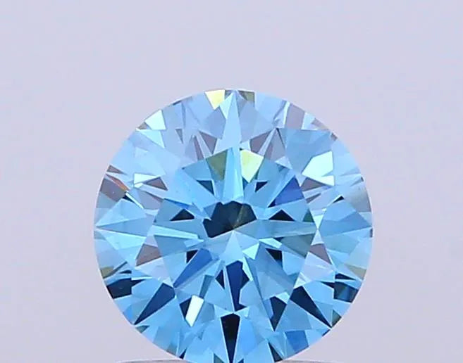A round, fancy vivid blue lab grown diamond with VS1 clarity.