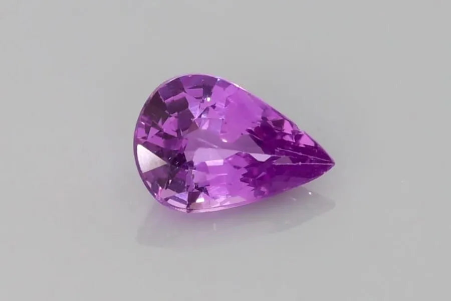 1.12ct pear-shaped faceted purple sapphire with eye-clean clarity.