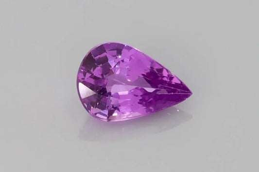 1.12ct pear-shaped faceted purple sapphire with eye-clean clarity.