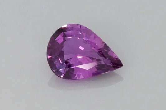 1.28 carat pear-shaped faceted purple sapphire.