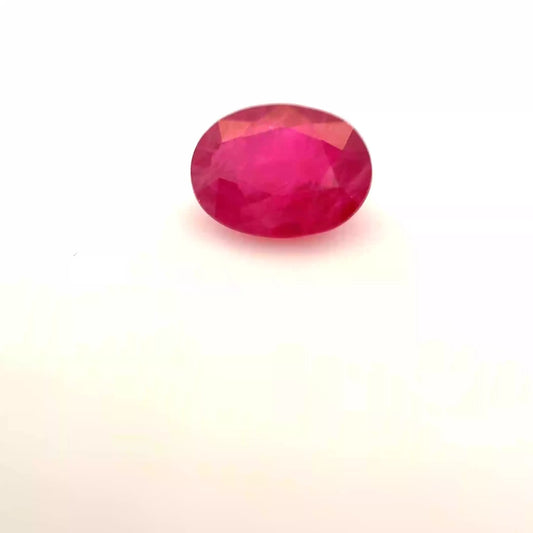 Oval faceted natural ruby, 1.35 carat, red color, slightly included clarity.