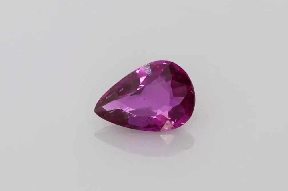 1.35 carat pear-shaped faceted purple sapphire.