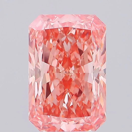 A radiant cut fancy vivid pink lab grown diamond.