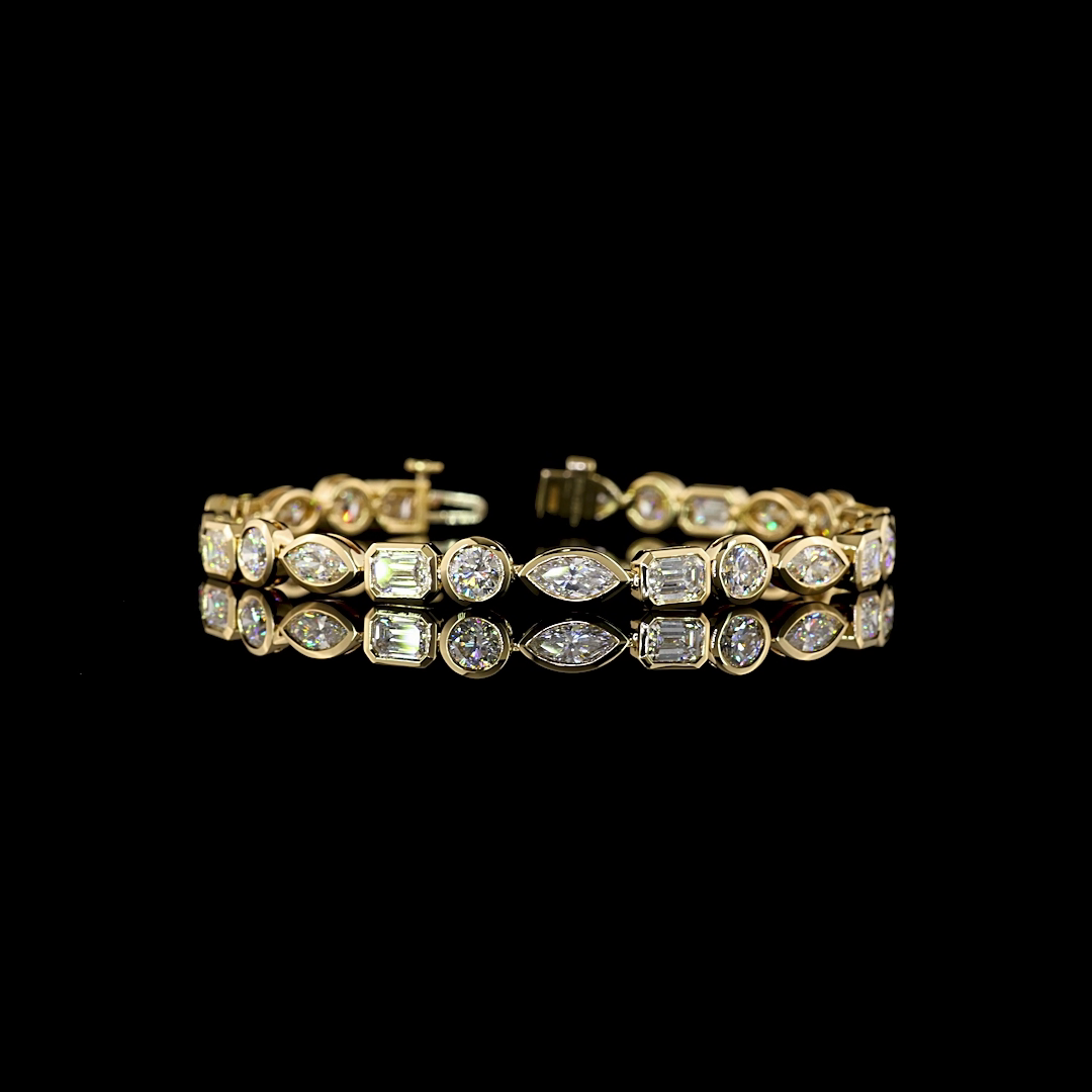 10ctw mixed shapes lab diamond tennis bracelet in 14k yellow gold.