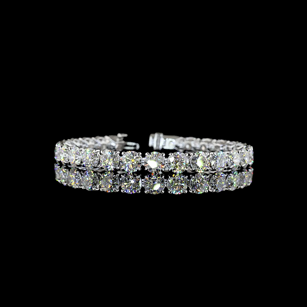 27.45ctw round cut lab grown diamond tennis bracelet in 14k white gold on a black background.