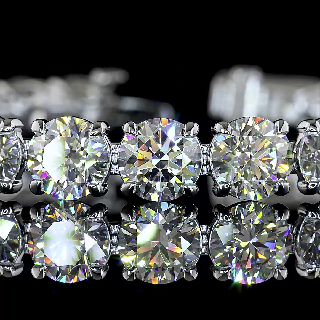 Close-up of a 27.45ctw lab grown diamond tennis bracelet in 14k white gold with round cut stones.