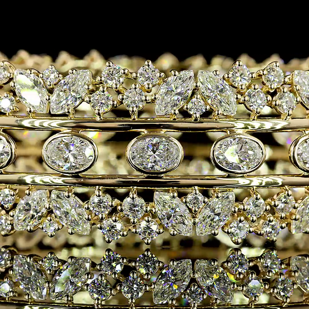 14k yellow gold hinged bangle with bezel-set oval and mixed-cut lab grown diamonds.