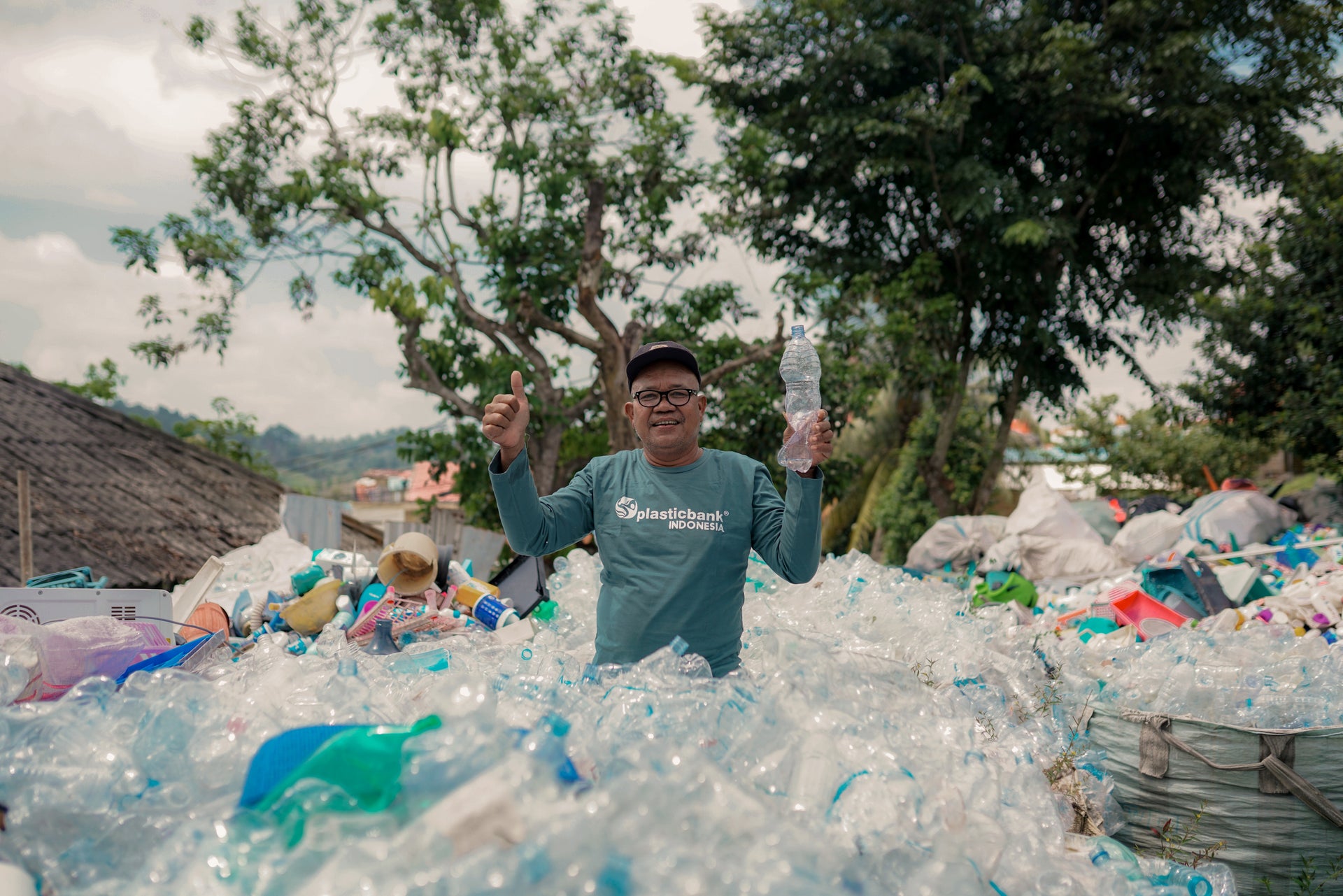 Load video: A video of Ngadimun explaining his positive experience working for Plastic Bank in Bali, which provides him with income and healthcare while he helps to clean plastic from the environment.