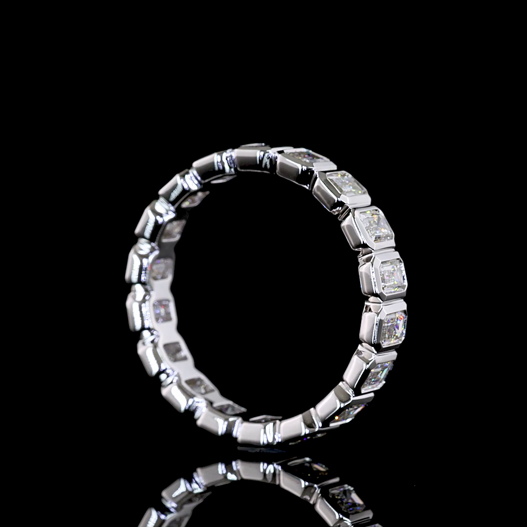 Lab grown emerald cut diamond eternity band in a 14k white gold bezel setting.