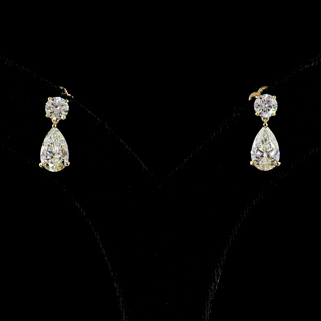 2.90ctw lab grown diamond drop earrings with round and pear cut stones in 14k yellow gold.