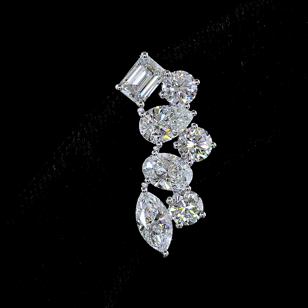 Lab grown diamond ear crawler earring with mixed shapes in 14k white gold on a black background.