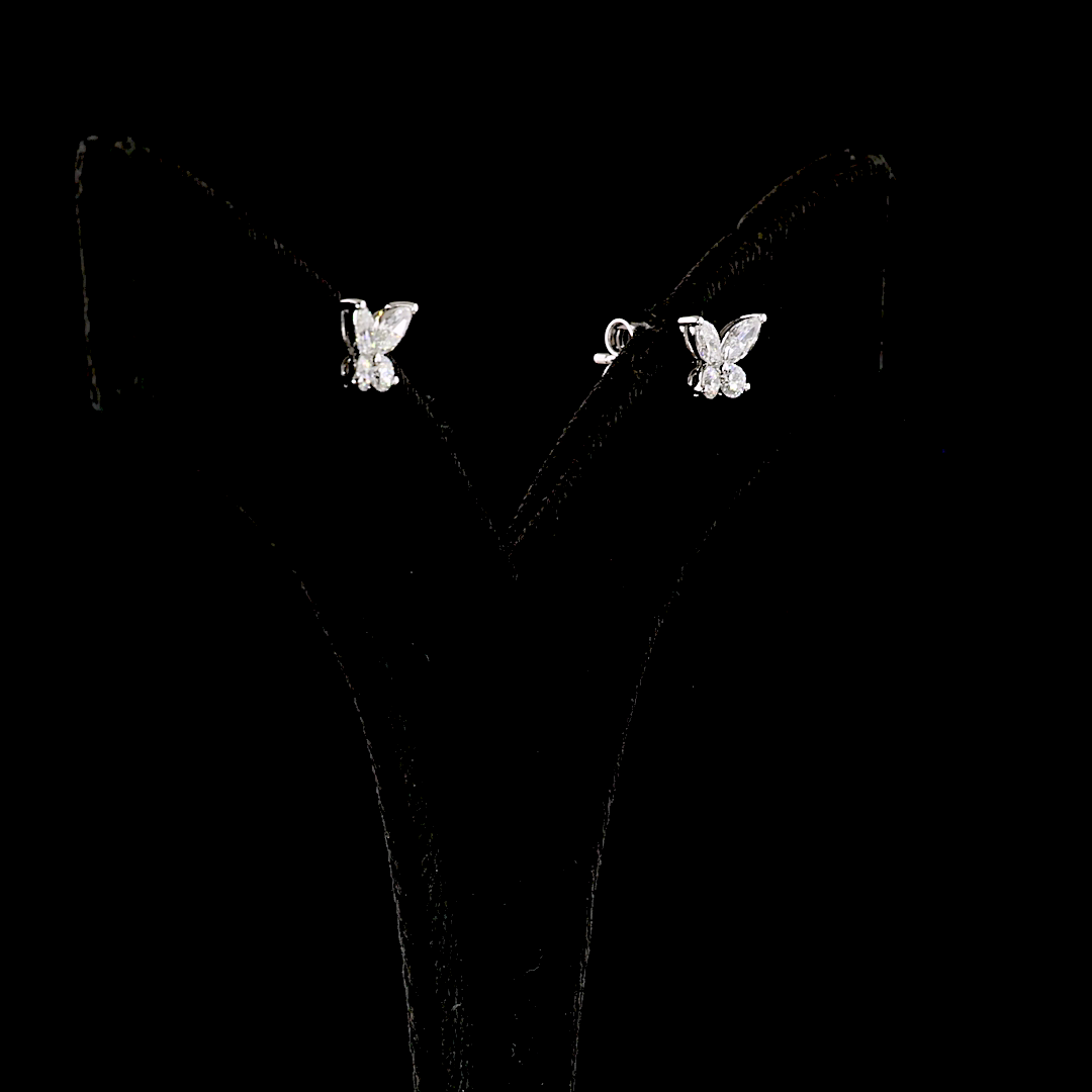 0.67ctw lab grown diamond butterfly stud earrings in 14k white gold on a black display stand.