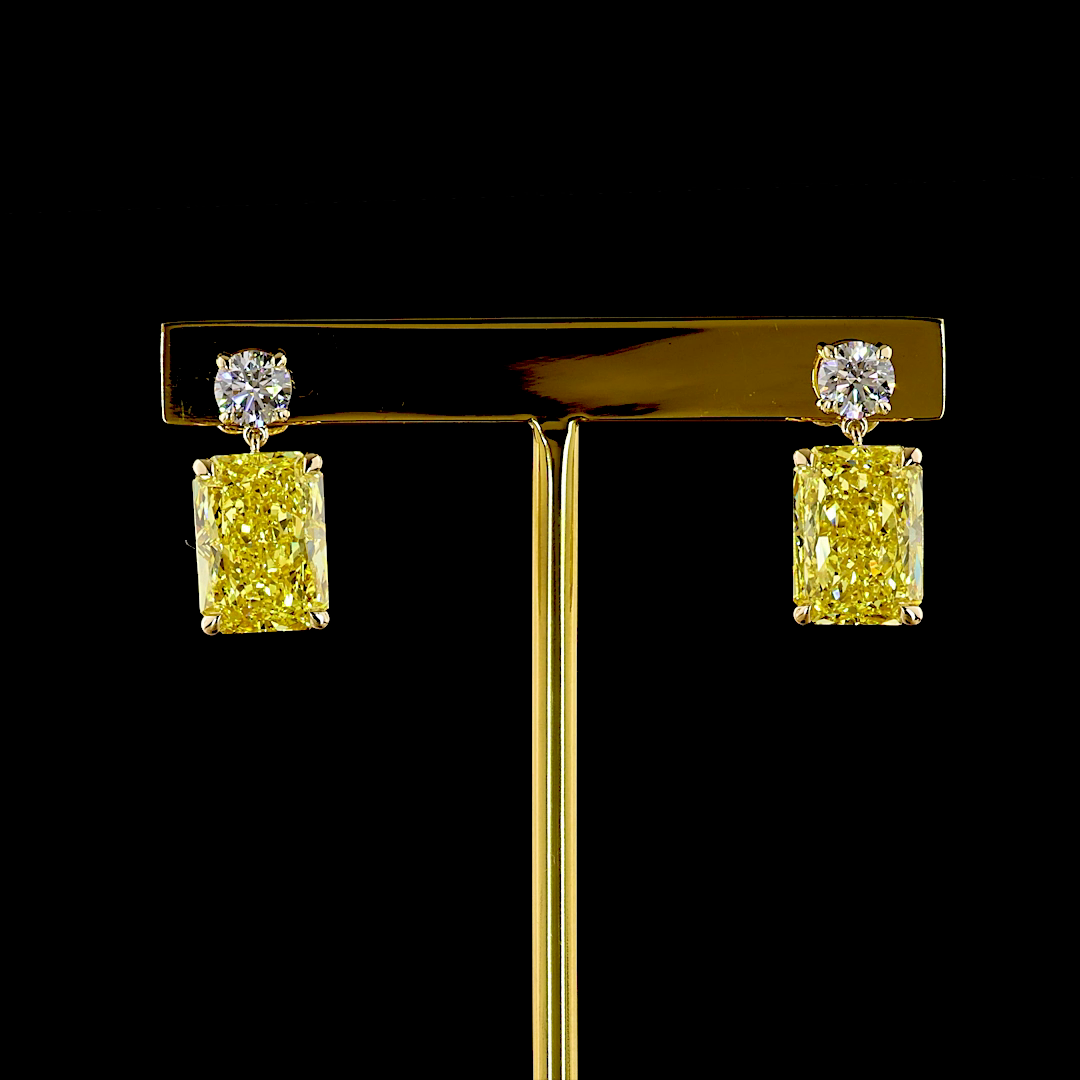 14k yellow gold earrings with round white and 10.87ctw radiant-cut fancy vivid yellow diamonds.