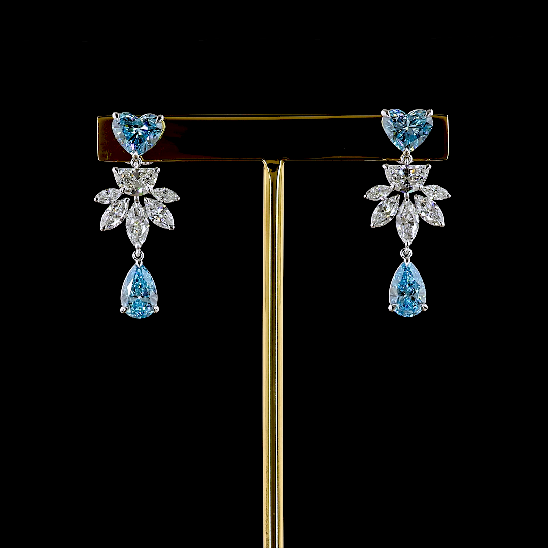 Lab grown diamond chandelier earrings with blue heart and pear stones and white marquise diamonds.