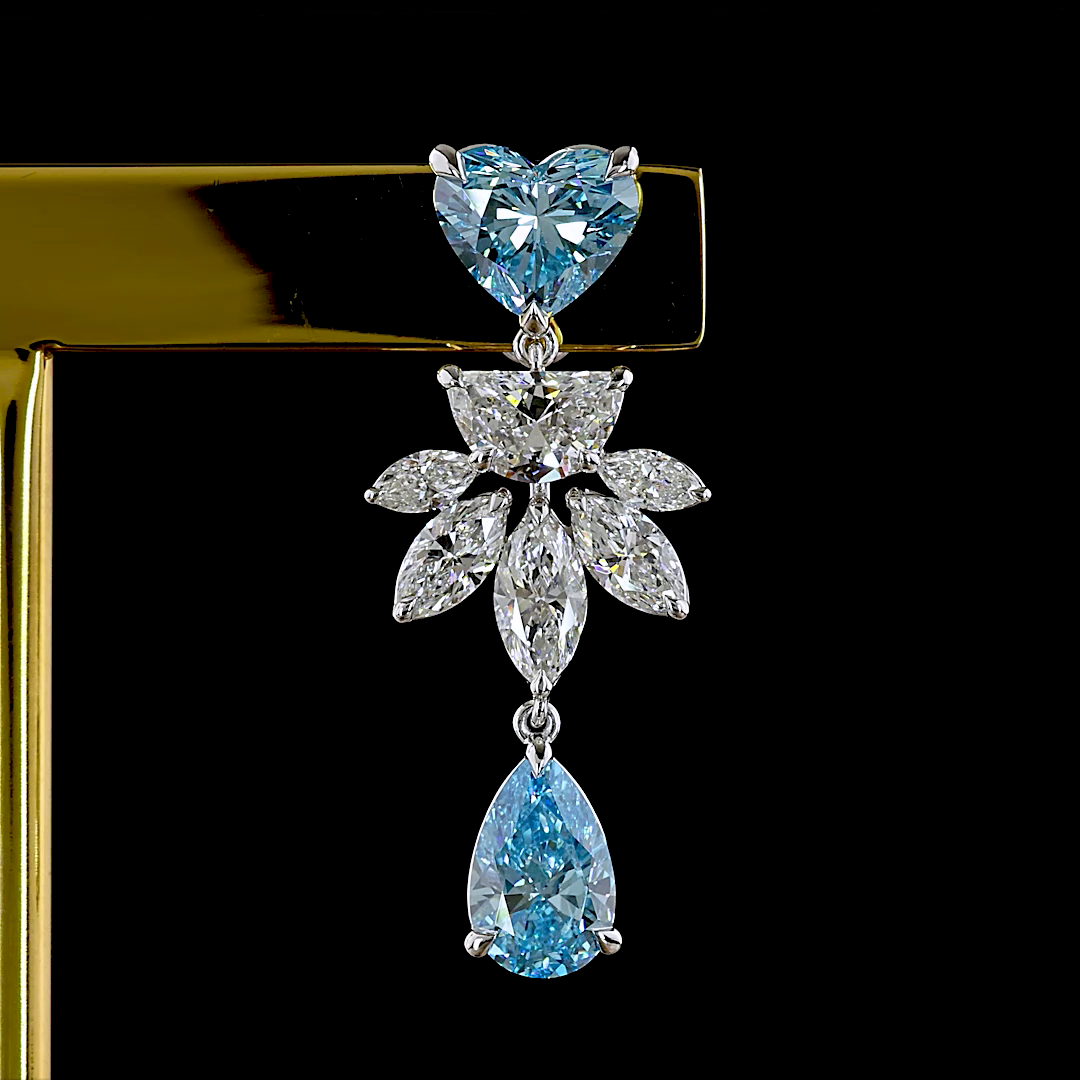 Lab grown diamond chandelier earring with blue heart and pear stones and white marquise diamonds.