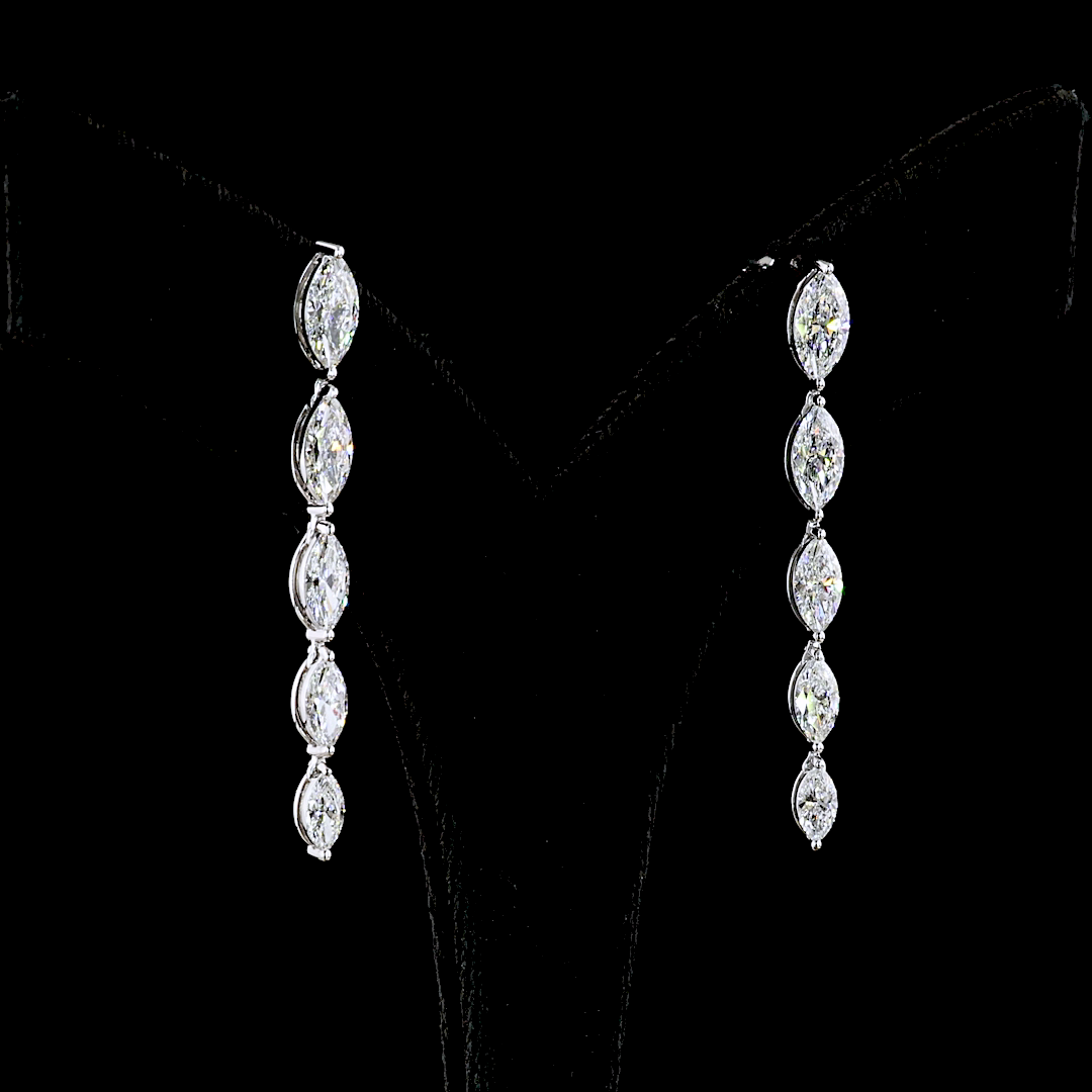 Lab grown marquise diamond drop earrings in 14k white gold on a black display stand.