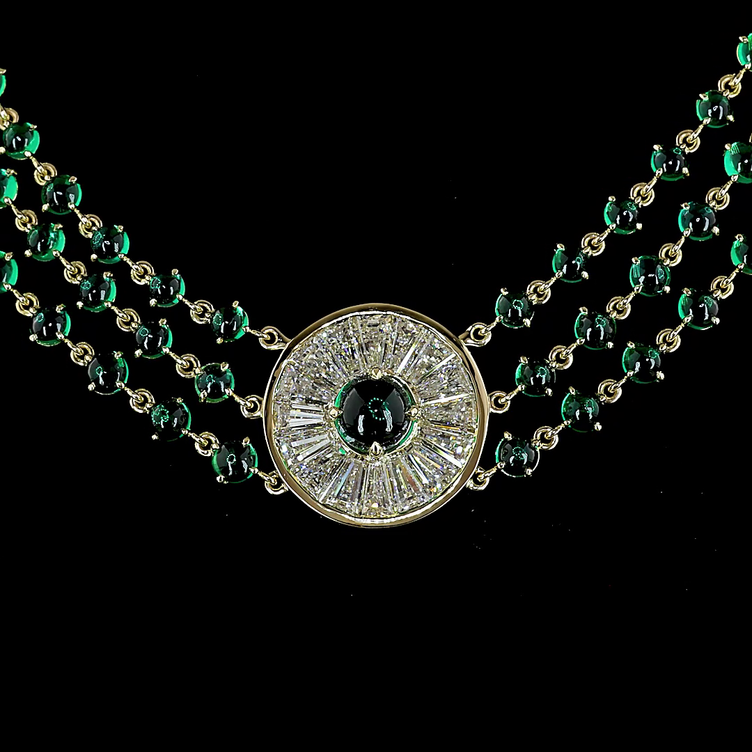 14k yellow gold necklace with lab grown diamond medallions and round cabochon emerald strands.