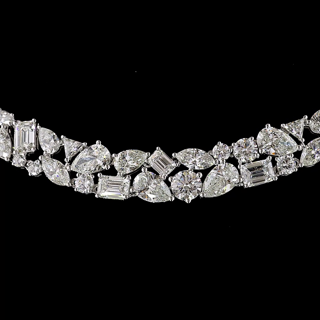 Close-up of a 14k white gold necklace featuring mixed-shape lab grown diamonds on a black background.
