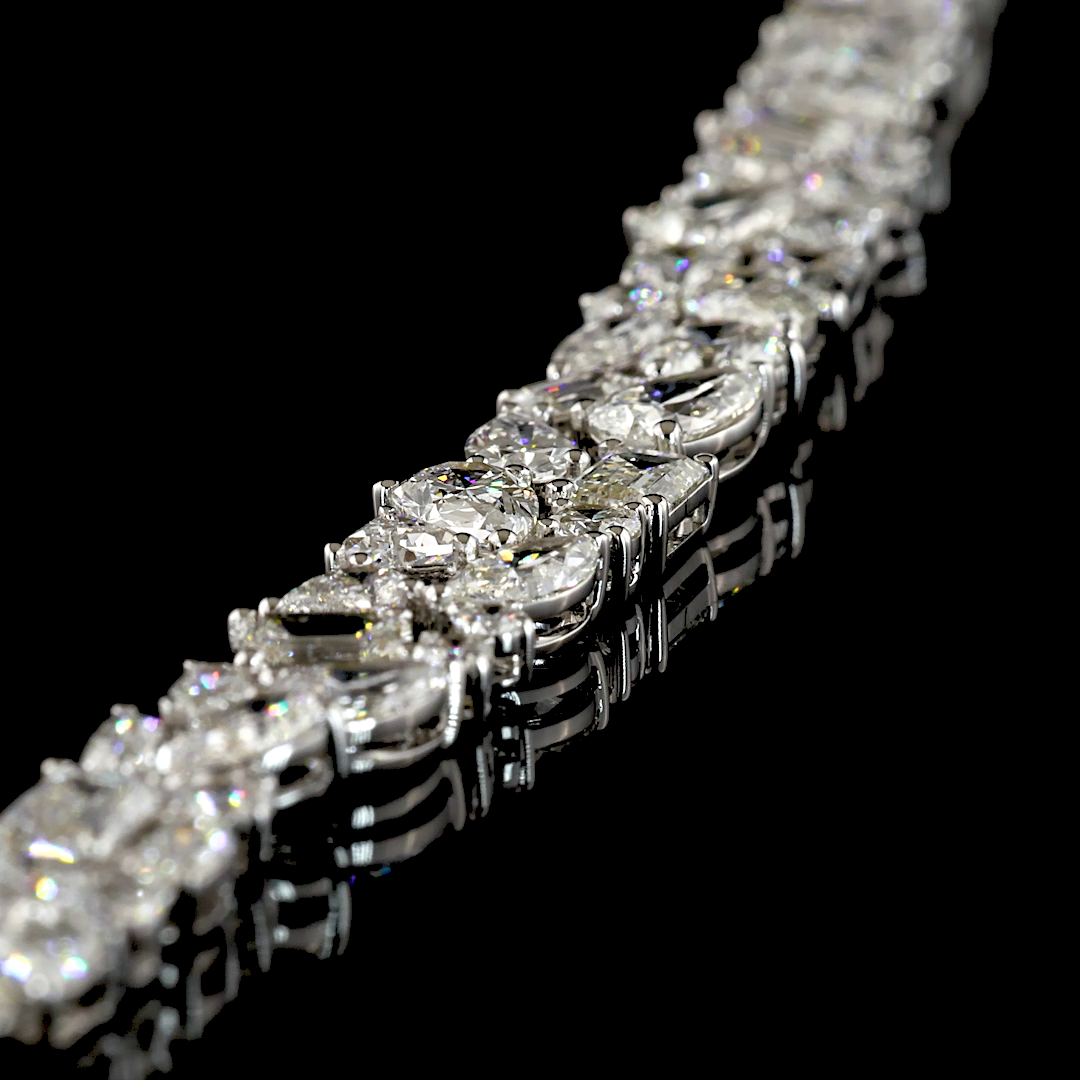 Close-up of a 14k white gold necklace featuring 16.39ctw of mixed-shape lab grown diamonds.