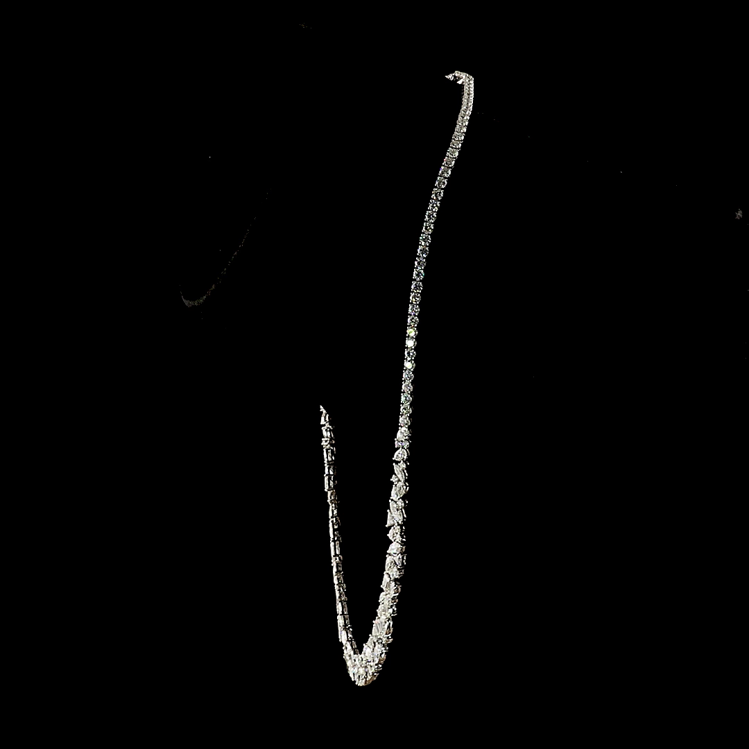 16.39ctw lab grown diamond mixed shape necklace in 14k white gold on a black background.