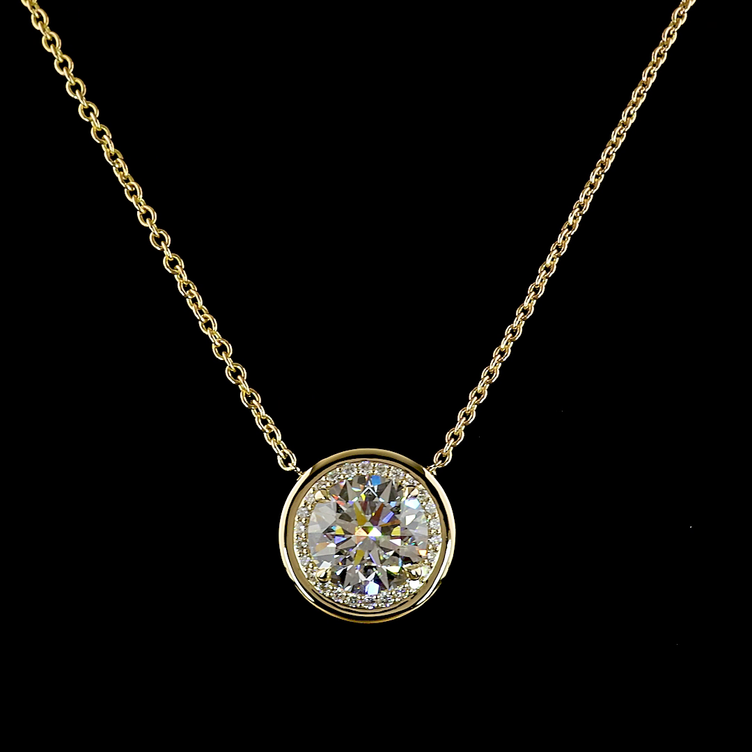 5.32ctw lab grown round diamond halo pendant in 14k yellow gold on a thin chain.