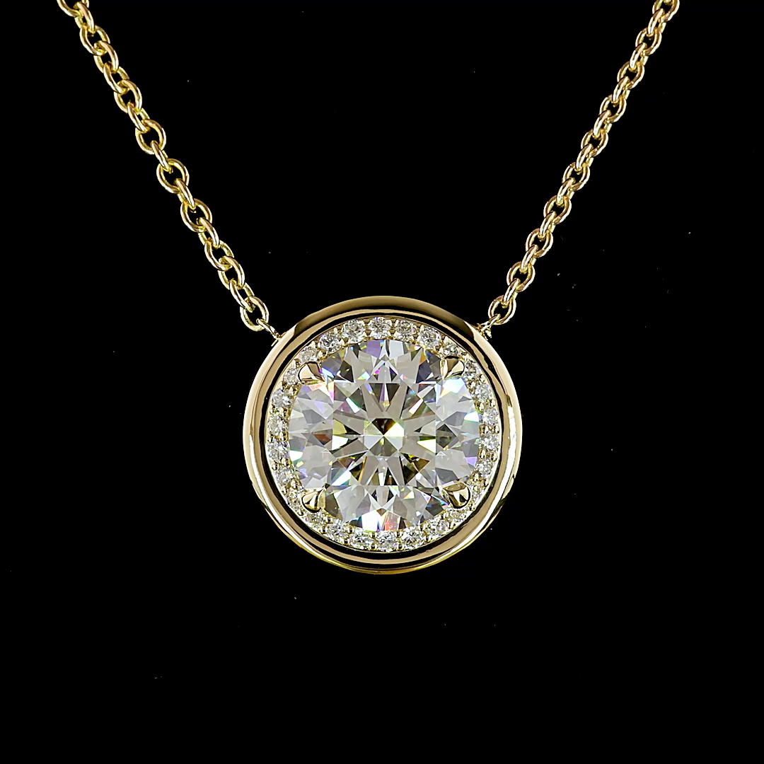 5.32ctw lab grown round diamond halo pendant in 14k yellow gold on a thin chain.