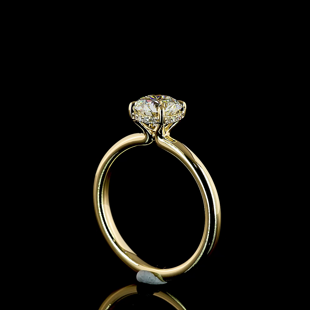 1.13ctw lab grown round brilliant diamond engagement ring in 14k yellow gold with a hidden halo.