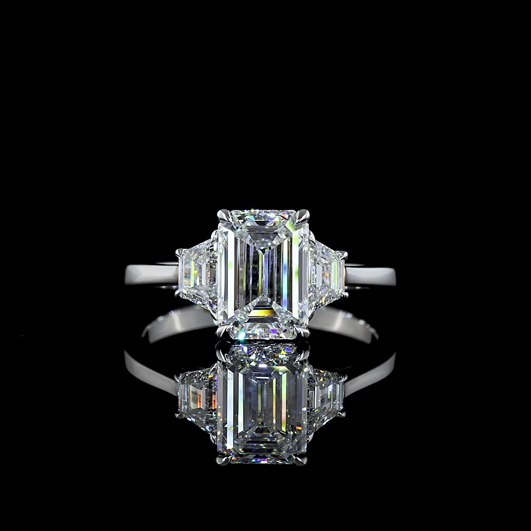 2.54 ctw lab grown emerald cut diamond three stone engagement ring.