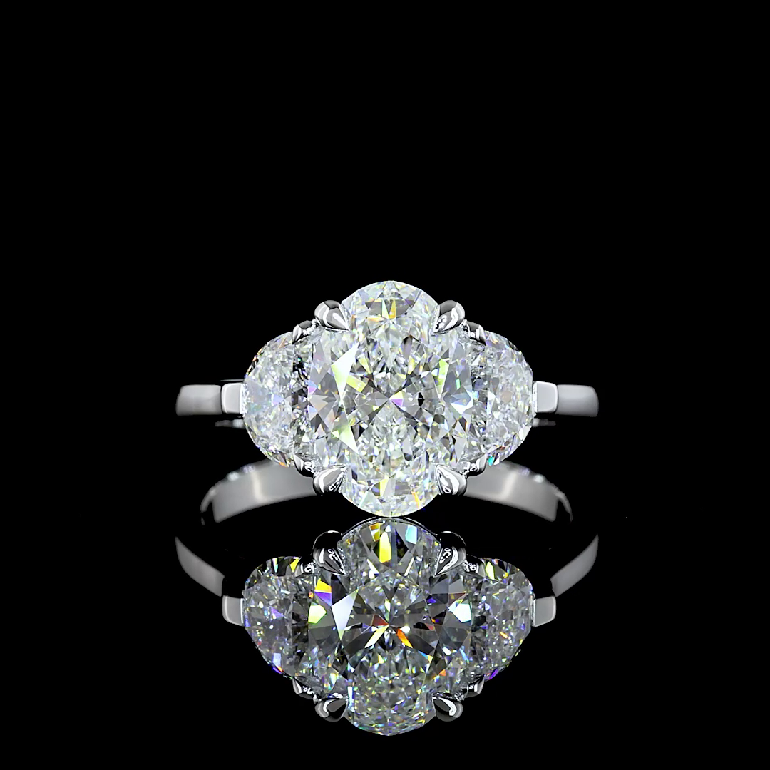 A 2.85ctw lab grown oval three stone diamond engagement ring.