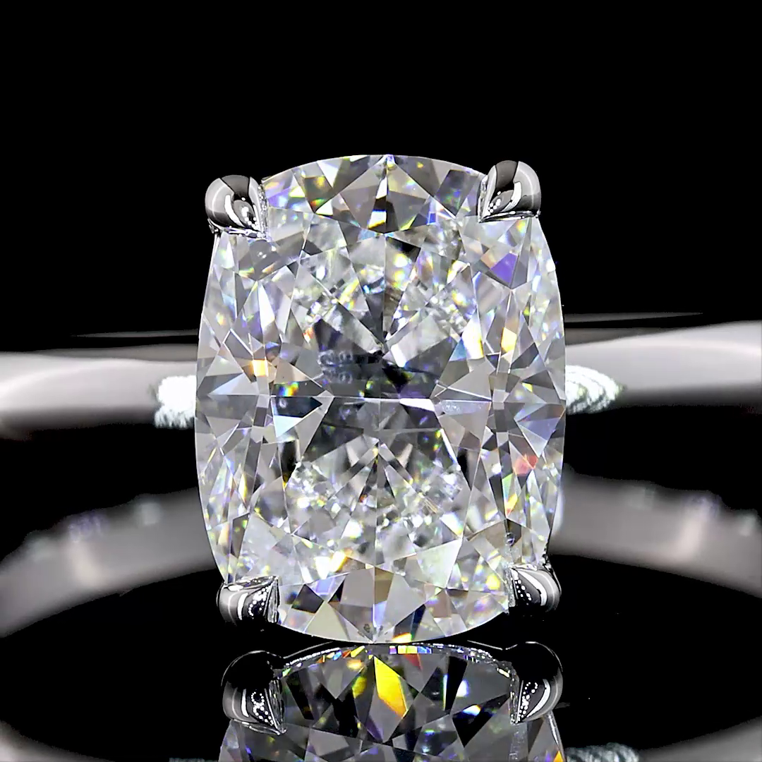 Lab grown cushion cut diamond solitaire engagement ring in 14k white gold.