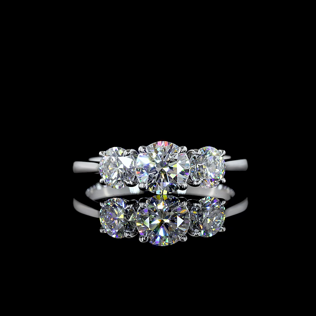 Three-stone lab grown diamond engagement ring in 14k white gold on a reflective black background.