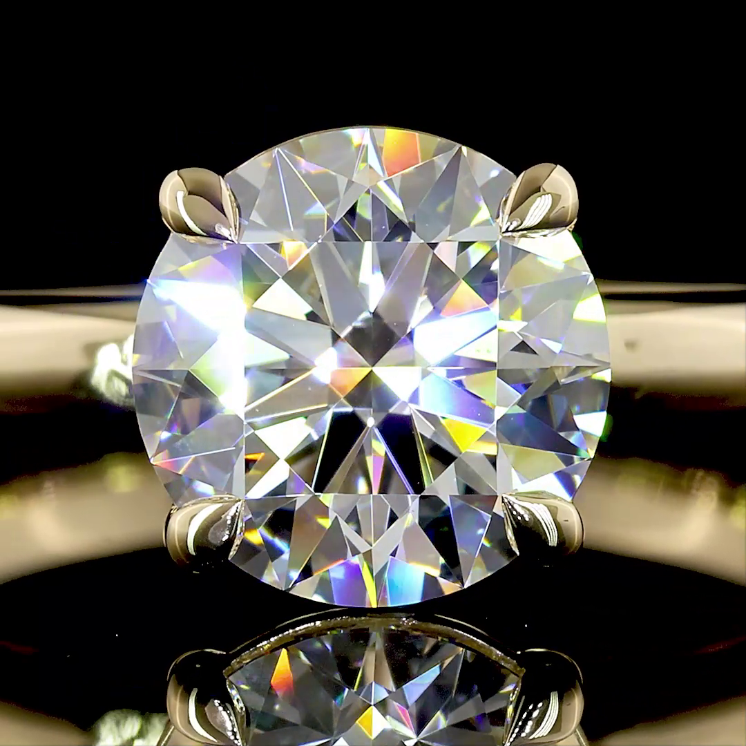 A 2.14ct round lab grown diamond solitaire engagement ring in 14k yellow gold.