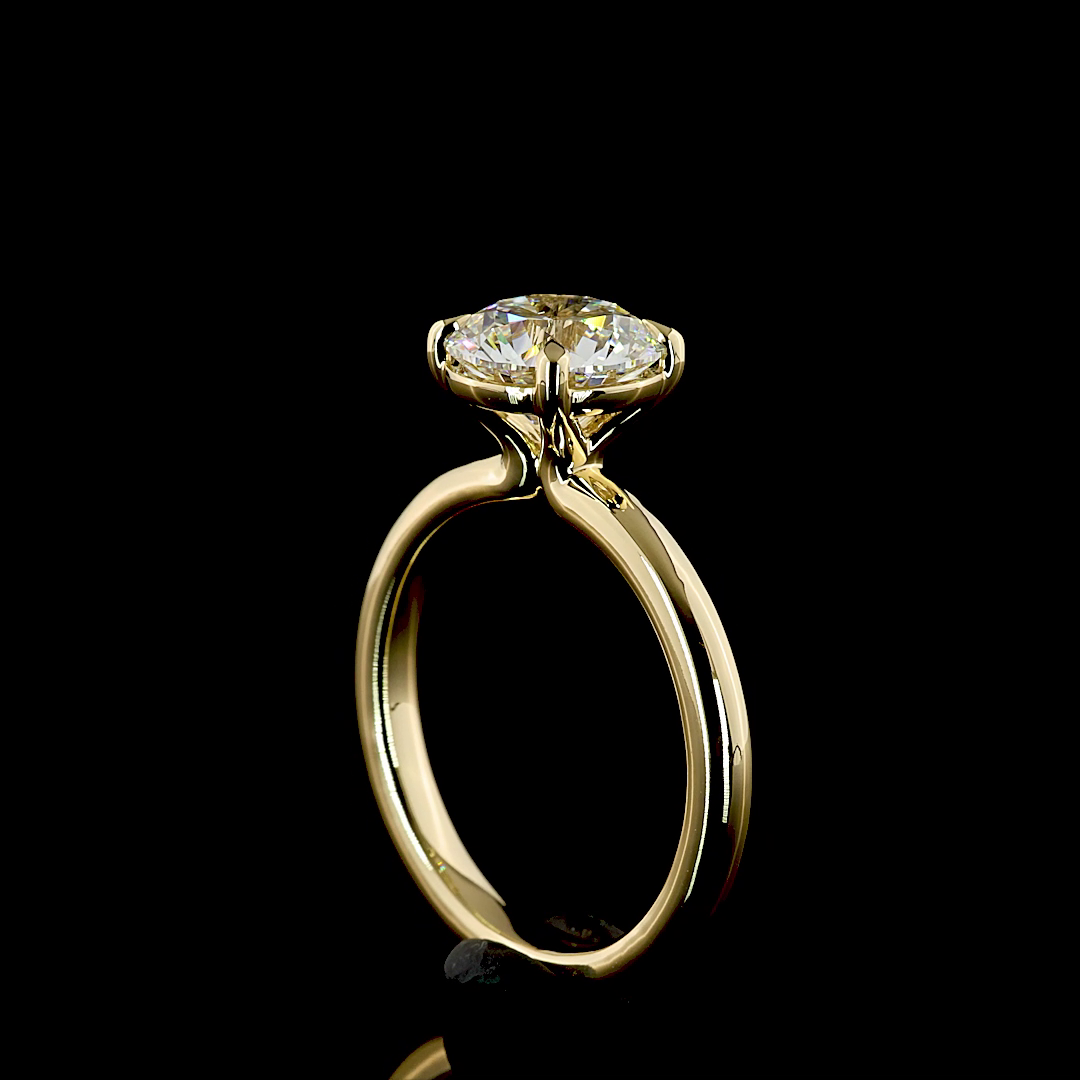 A 2.14ct round lab grown diamond solitaire engagement ring in 14k yellow gold.