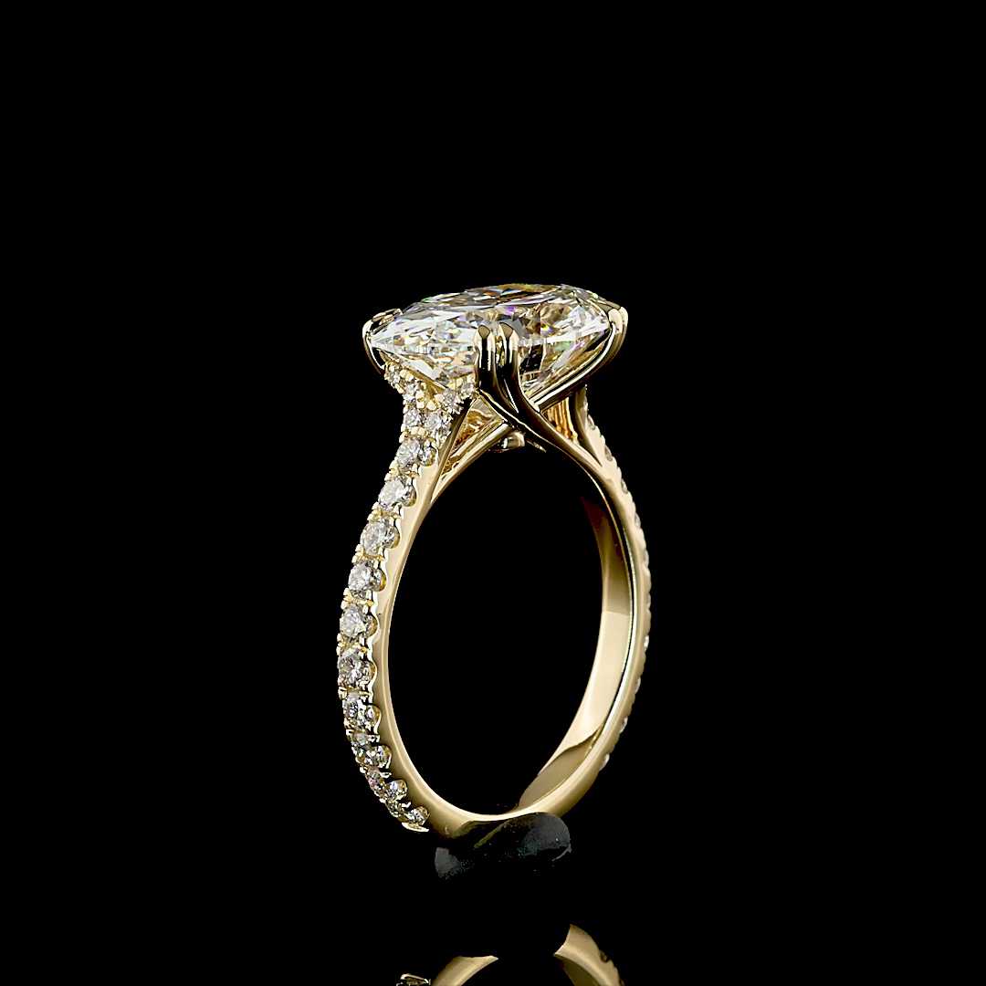 4.89ctw oval lab grown diamond engagement ring in 14k yellow gold with diamond-set band.