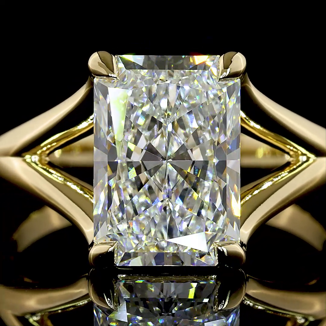 3.12ct radiant cut lab grown diamond engagement ring in a 14k yellow gold split shank setting.