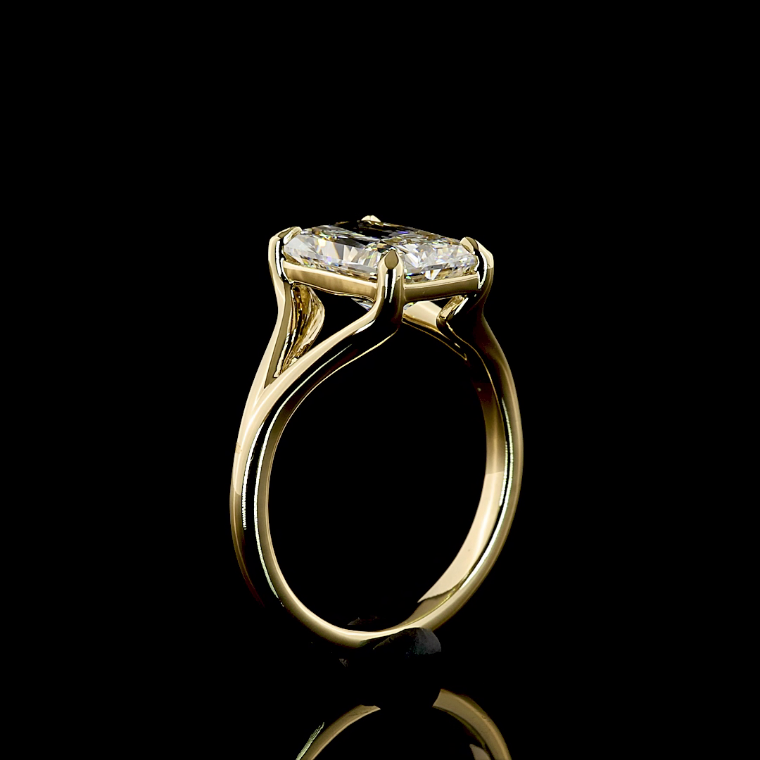 3.12ct lab grown radiant cut diamond engagement ring in 14k yellow gold with a split shank setting.