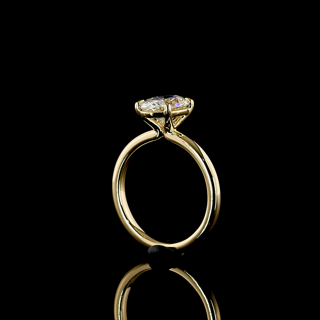 Side view of a 2.12ct lab grown oval diamond solitaire engagement ring in 14k yellow gold.