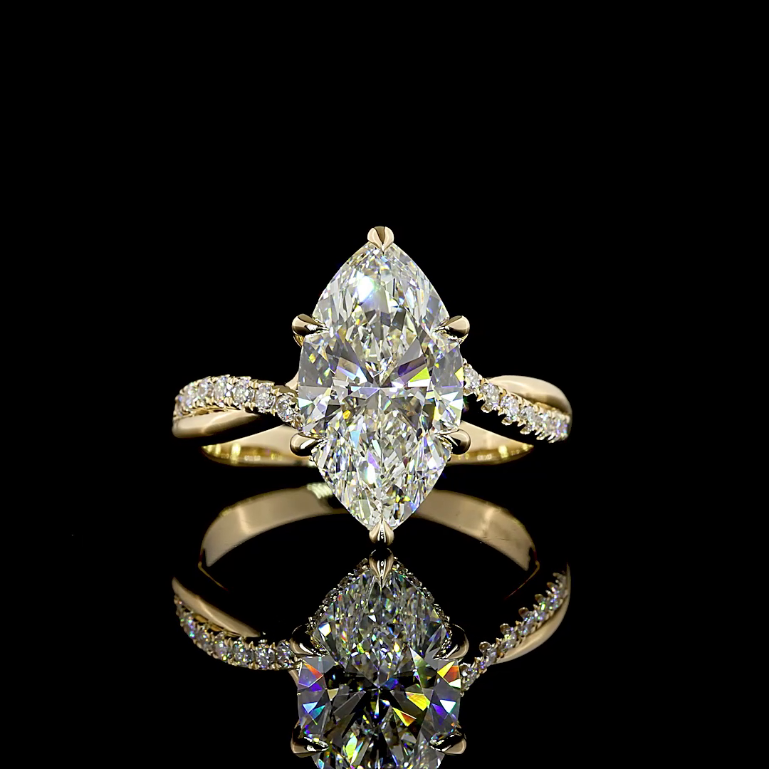 3.48ctw lab grown marquise diamond engagement ring in 14K yellow gold with an entwined diamond band.