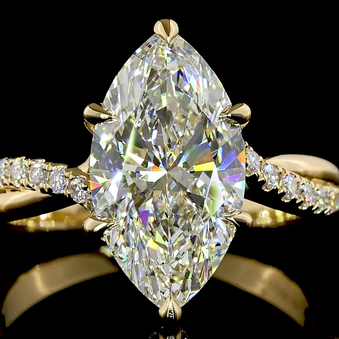 3.48ctw lab grown marquise diamond engagement ring in 14K yellow gold with an entwined diamond band.