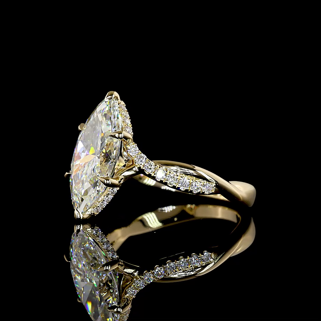3.48ctw lab grown marquise diamond engagement ring in 14K yellow gold with an entwined diamond band.
